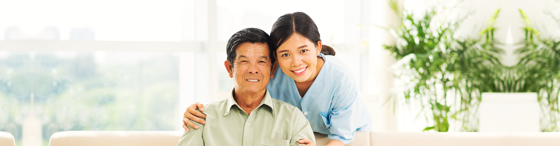 asian old man with his asian caregiver